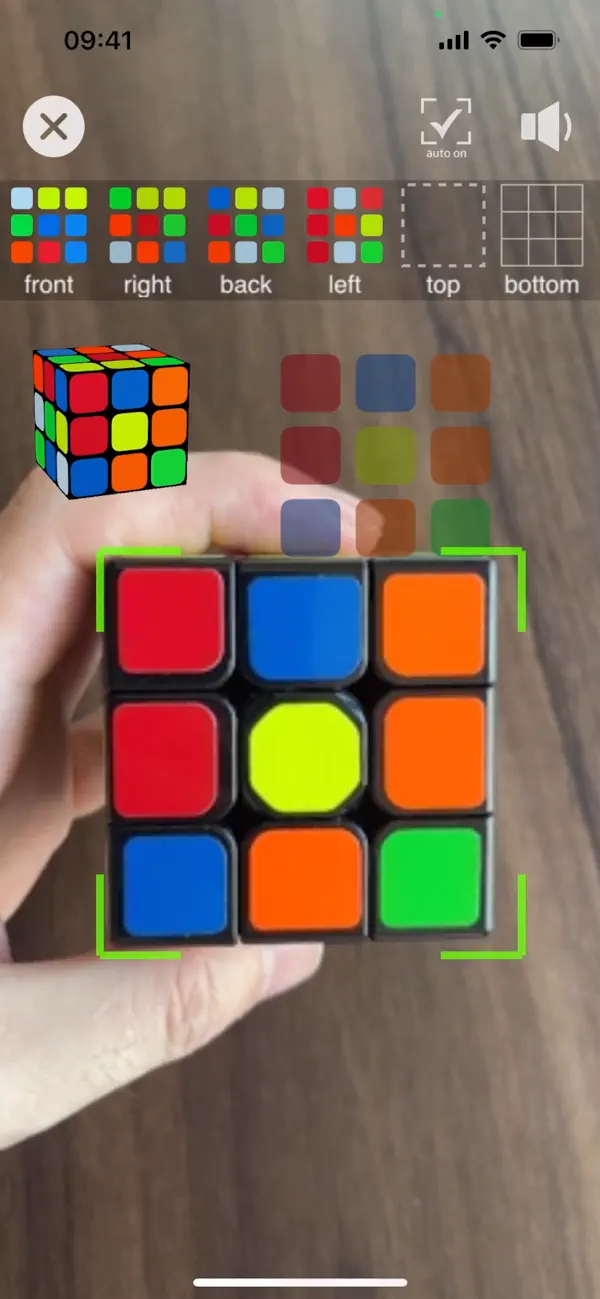 The iPhone app scanning the colored facelets of a physical cube